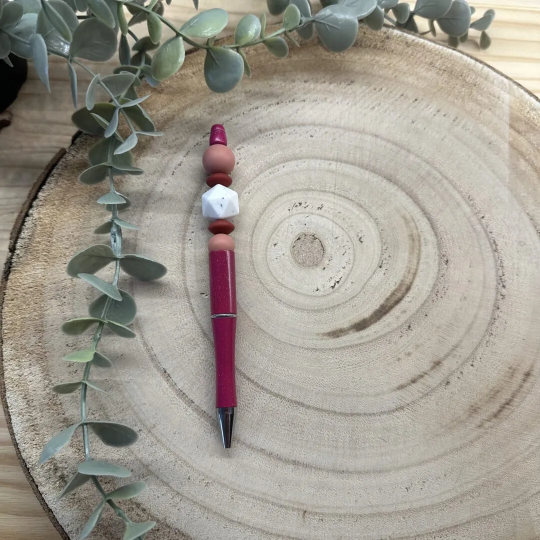 Stylo rose pailleté blanc granité