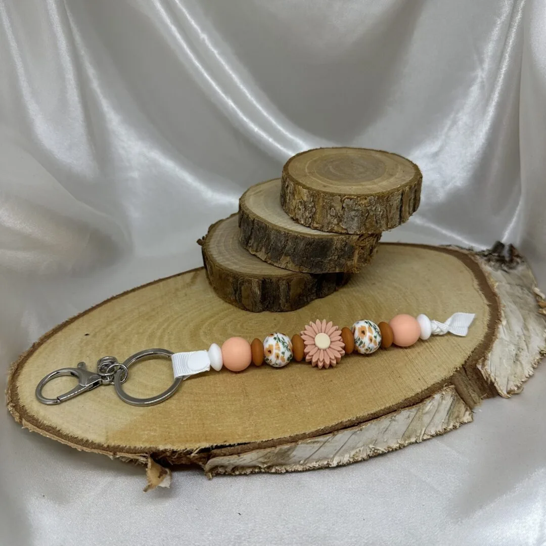 Porte-clés marguerite pêche